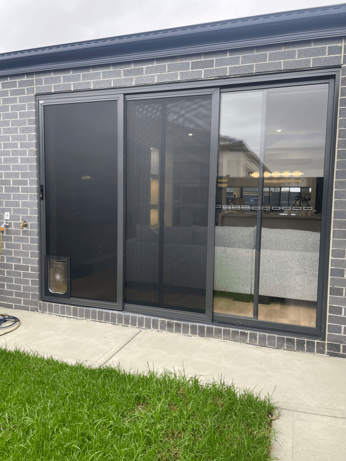 Large pet door on ALUGard door
